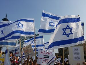 Israeli flags protesting with sign Hamas = Terrorist