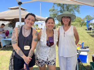 Briana Anderson stands alongside other Resilient Activist team members at the outdoor 2023 Big Bluestem Bash Fundraiser to increase long term support of the nonprofit's resilience programming. Photo Credit: Briana Anderson